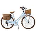 bici da città dolce vita by donna con borse e cesto azzurro